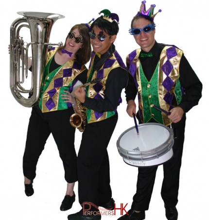 Three roving musicians dressed in venetian costumes posing