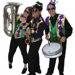 Three roving musicians dressed in venetian costumes posing