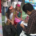 Showing his talent at a family party at the American Club in Hong Kong.