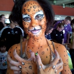 leopard arm and face paint.