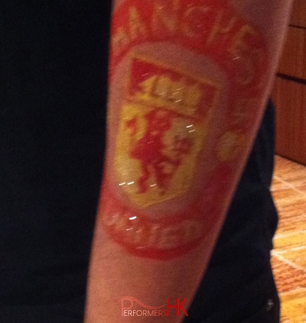 Manchester united body painted on arm.