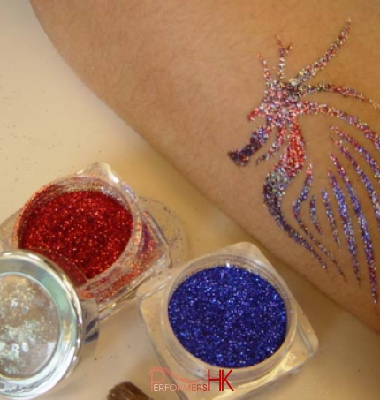 A red and blue glittering tattoo done by a tattoo artist in HK at a Xmas kids event.