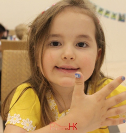 A little girl in HK showing off her new nail art at a children birthday party
