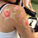 A very good option if you dont want to ruin your make up - elegant arm and back flower paint.