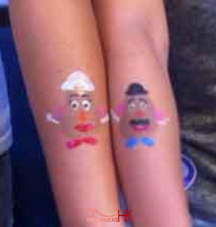 Hong Kong face painter draw a matching Mr. Potato Head and Mrs. Potato Head arm paint for a couple at a corporate event. 