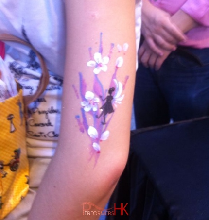 A nice arm paint with fairy , white ,pink and purple flowers,