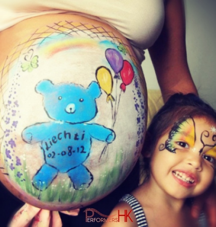 Pregnant belly face painting 