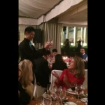 Contact juggler showing tricks to guest.