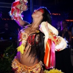 A Dancer in HK dancing with two snake at a cocktails event