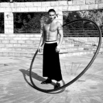 HK acrobatics artist posing with his wheel for a corporate event