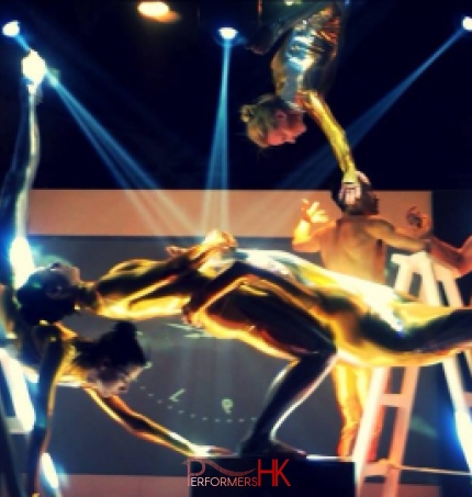Eight Acrobat performers performing at a corporate event