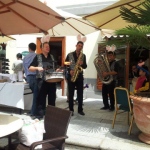 Three roving band musicians performing at a corporate Ester event in Hong Kong 