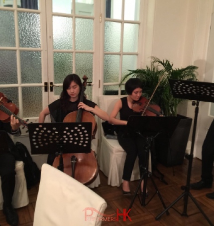 Four Hong Kong String players performing at the wedding reception