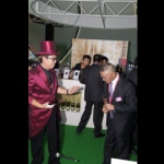 Magician performing a table magic trick at a corporate cocktail event in Hong Kong