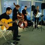 Oscar Sax performs with guitar and cello players. 
