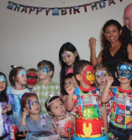 large group of kids at birthday party all with painted faces
