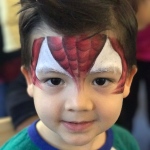 Boy with spiderman face painting