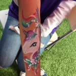 unicorn painted on arm from rainy