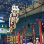 Lion dance dancers jump from one pole to another, displaying their amazing skills. 