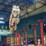 Lion dance dancers jump from one pole to another, displaying their amazing skills. 