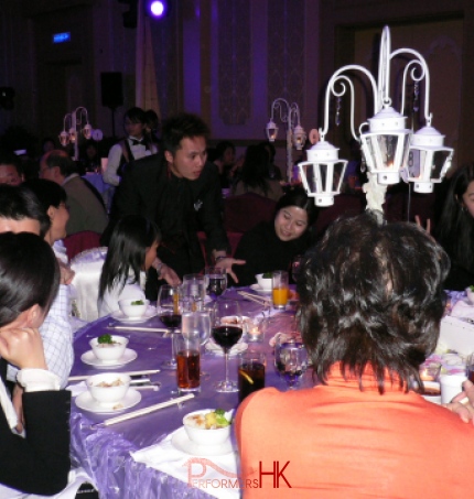Hong Kong walk around magician performing table magic at corporate annual dinner  