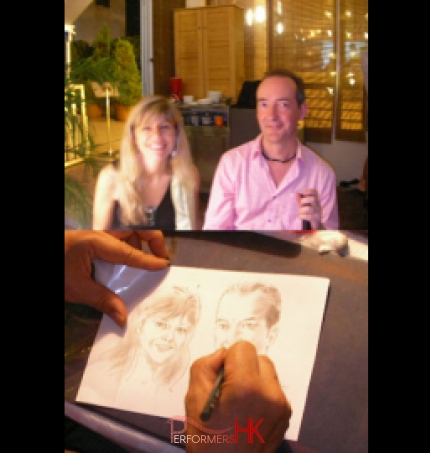 Caricaturist drawing two people at a corporate event