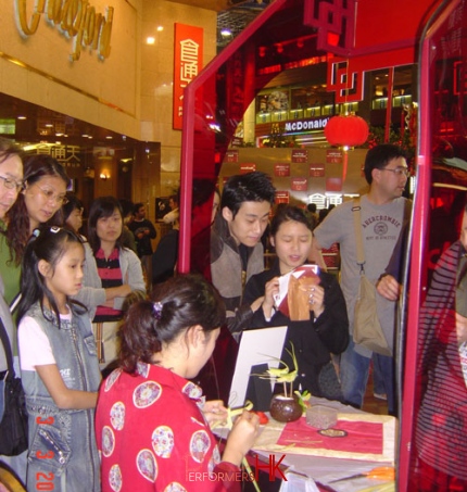 Grass-hoppers artist making Grasshoppers to the guests at Hong Kong Times Square