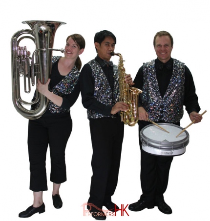 a three piece roving band in sparkle vests 