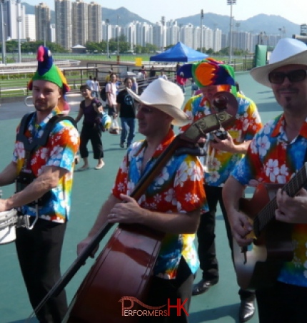 Four roving magicians playing drums guitar cello entertaining crowds at the Hong Kong racecourse