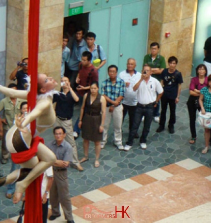 Outdoor performance by female aerial skills artist