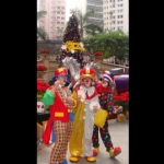 Dressed up as clowns, performers entertain guests with their magic tricks.