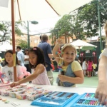Kids making a craft mobile at the American Club Hong Kong.