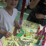 This girl is creating her very own artwork.