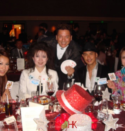 Magician performs table magic with cards to four celebrities at Watsons Hong Kong annual dinner 