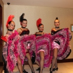 Can can dancers posing with their fluffy pink dresses at HKCEC.