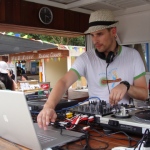 Professonal DJ Djing in an outdoor event.