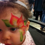 Poinsettia face paint.