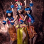 Hula and Tahiti Dancers posing in their tropical costumes.