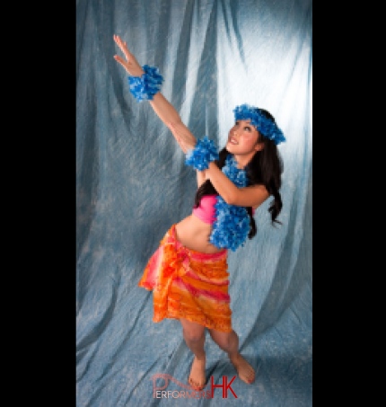 Female hula dancer in Hong Kong dressed in orange and blue