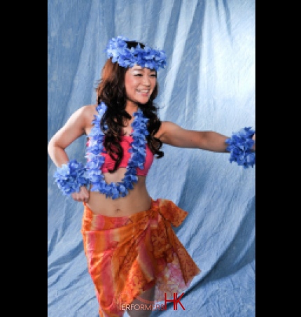 Hula dancer doing basic hula move in bright costume