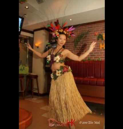 Hong Kong hula dancer performing traditional hula dance, wearing beautiful headpiece