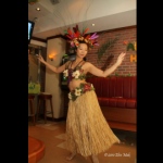 Hula dancer wearing a gorgeous headpiece for her performance. 