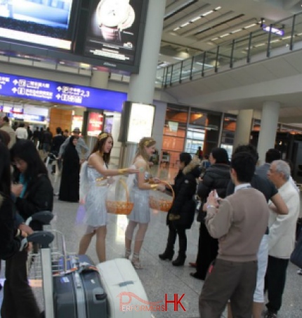 Two model wearing Venue costume walking around at the HK airport giving out Valentine day gift to tourists