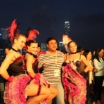 HKTDC event with Can can dancers, guests enjoying the networking event with beautiful dancers and backdrop of Hong Kong.