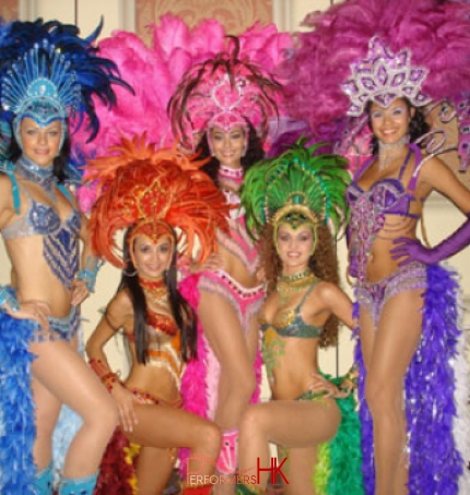 Promotional studio shot of 5 Brazilian dancers in full costume at the disney hotel in Hong Kong