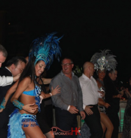 dancers with staff from a company dancing at a cocktail
