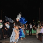 Interacting with guests at a corporate function. Guests are asks to come dance with the girls.