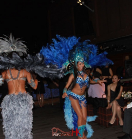 two samba dancers dancing whilst guests look on