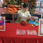 Professional artist in Chinese costume making Chinese Knot giveaway , a must item for Chinese themed event.