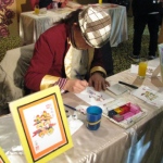 The rainbow calligraphy artist drawing a calligraphy for guest.